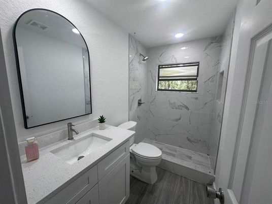 Bathroom, Glass Shower, Interior, Marble Walls, Recessed Lighting, Wood Texture Flooring
