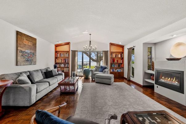 Chandelier, Fireplace, Interior, Living room, Recessed Lighting, Wood Texture Flooring