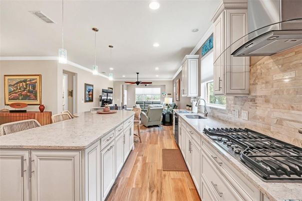 Dining room, Interior, Kitchen, Living room, Pendant Lights, Recessed Lighting, Stainless Steel Appliances, Wood Texture Flooring