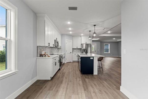 Interior, Kitchen, Pendant Lights, Recessed Lighting, Stainless Steel Appliances, Wood Texture Flooring