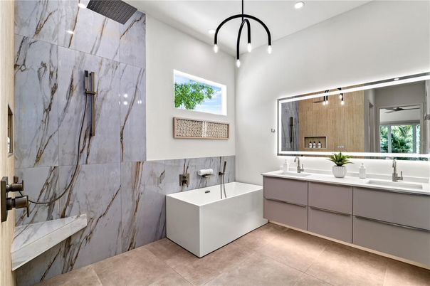 Bathroom, Dual Sink Vanities, Free Standing Baths, Interior, Marble Walls, Pendant Lights, Recessed Lighting