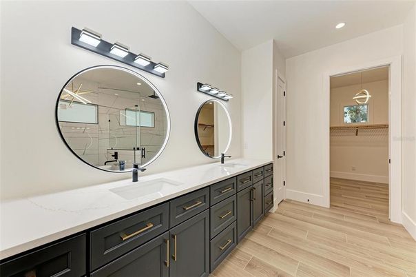 Bathroom, Dual Sink Vanities, Interior, Pendant Lights, Recessed Lighting, Wood Texture Flooring