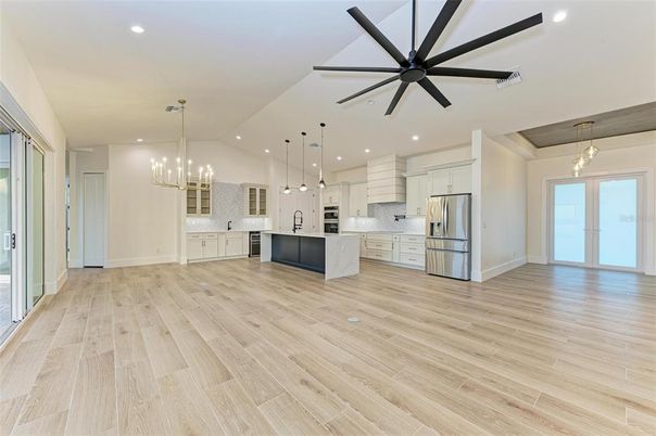 Chandelier, Interior, Kitchen, Pendant Lights, Recessed Lighting, Stainless Steel Appliances, Wood Texture Flooring