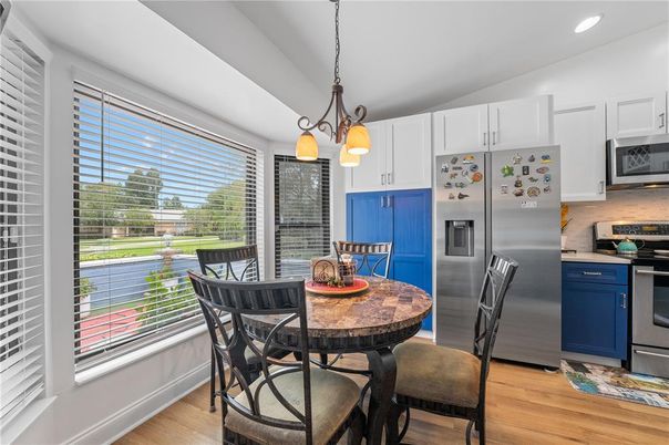 Dining room, Interior, Kitchen, Pendant Lights, Recessed Lighting, Stainless Steel Appliances, Wood Texture Flooring