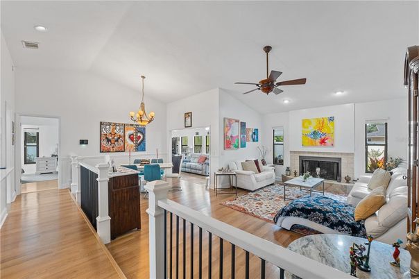 Chandelier, Dining room, Fireplace, Interior, Living room, Recessed Lighting, Wood Texture Flooring