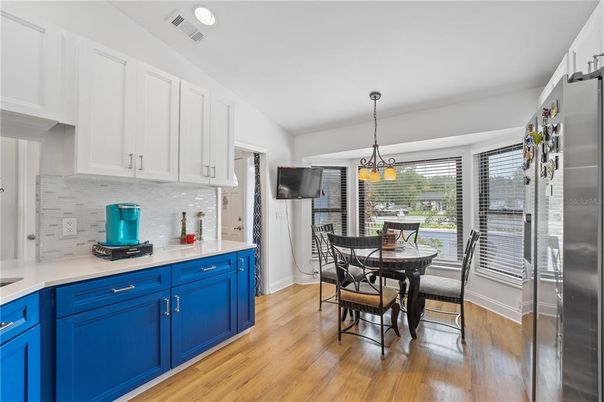 Dining room, Interior, Kitchen, Pendant Lights, Recessed Lighting, Stainless Steel Appliances, Wood Texture Flooring