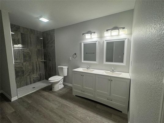 Bathroom, Dual Sink Vanities, Glass Shower, Interior, Wood Texture Flooring