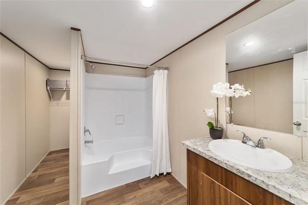 Bathroom, Dual Sink Vanities, Interior, Recessed Lighting, Walk-in Closets, Wood Texture Flooring