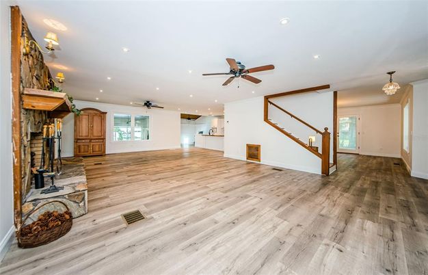 Chandelier, Empty room, Fireplace, Interior, Recessed Lighting, Wood Texture Flooring