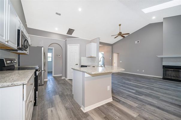 Fireplace, Interior, Kitchen, Recessed Lighting, Wood Texture Flooring