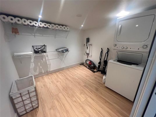 Fitness Equipment, Interior, Recessed Lighting, Utility Closets, Washer, Wood Texture Flooring