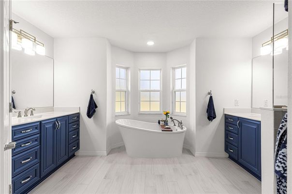 Bathroom, Dual Sink Vanities, Free Standing Baths, Interior, Recessed Lighting, Wood Texture Flooring