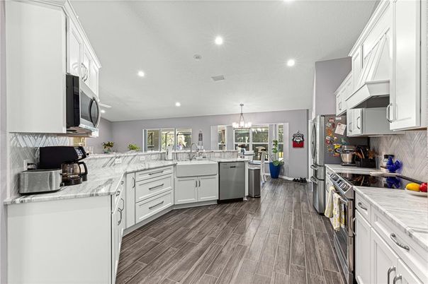 Chandelier, Interior, Kitchen, Recessed Lighting, Stainless Steel Appliances, Wood Texture Flooring