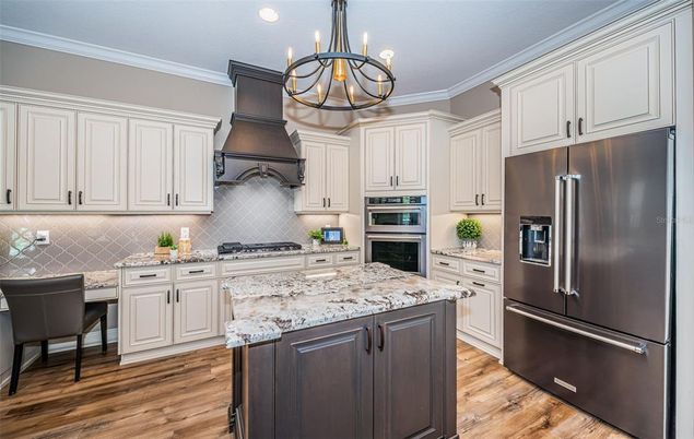 Chandelier, Interior, Kitchen, Recessed Lighting, Stainless Steel Appliances, Wood Texture Flooring