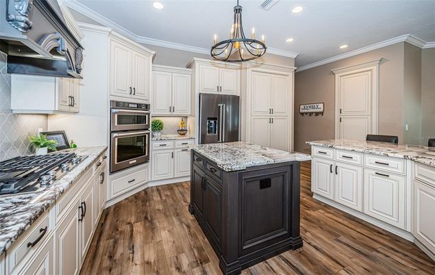 Chandelier, Interior, Kitchen, Pendant Lights, Recessed Lighting, Stainless Steel Appliances, Wood Texture Flooring