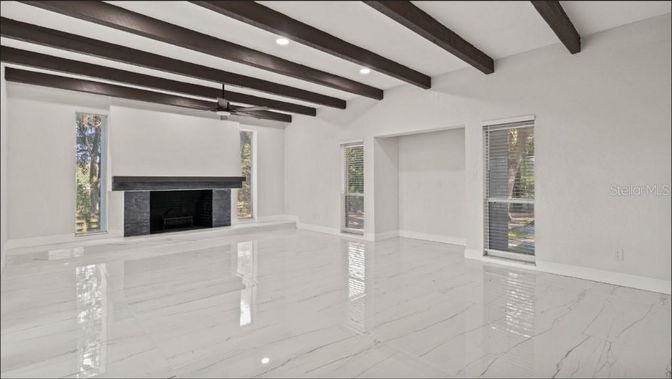 Empty room, Fireplace, Interior, Marble, Recessed Lighting, Wooden Beams