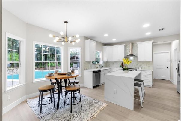 Dining room, Interior, Kitchen, Pendant Lights, Recessed Lighting, Stainless Steel Appliances, Wood Texture Flooring