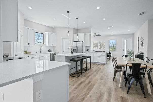 Dining room, Interior, Kitchen, Pendant Lights, Recessed Lighting, Stainless Steel Appliances, Wood Texture Flooring