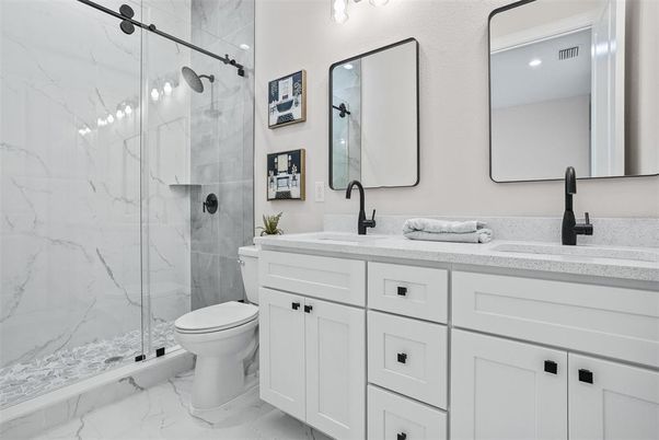 Bathroom, Dual Sink Vanities, Glass Shower, Interior, Marble, Marble Walls, Recessed Lighting