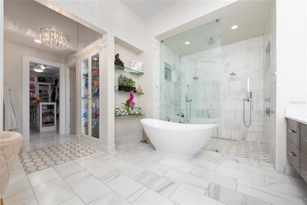 Bathroom, Chandelier, Free Standing Baths, Glass Shower, Interior, Marble, Marble Walls, Recessed Lighting