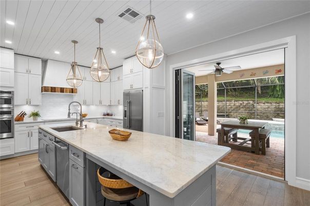 Dining room, Interior, Kitchen, Pendant Lights, Recessed Lighting, Stainless Steel Appliances, Wood Texture Flooring