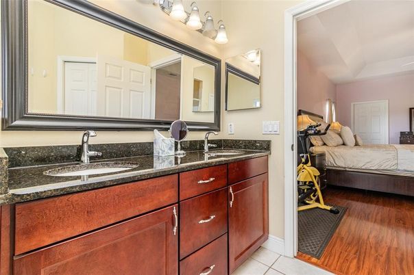 Bathroom, Bedroom, Dual Sink Vanities, Fitness Equipment, Interior, Wood Texture Flooring