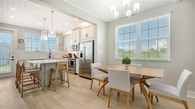 Chandelier, Dining room, Interior, Kitchen, Pendant Lights, Recessed Lighting, Stainless Steel Appliances, Wood Texture Flooring