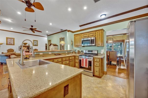 Dining room, Interior, Kitchen, Living room, Recessed Lighting, Stainless Steel Appliances, Wood Texture Flooring