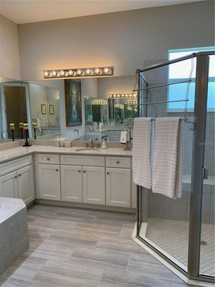 Bathroom, Dual Sink Vanities, Glass Shower, Interior, Wood Texture Flooring