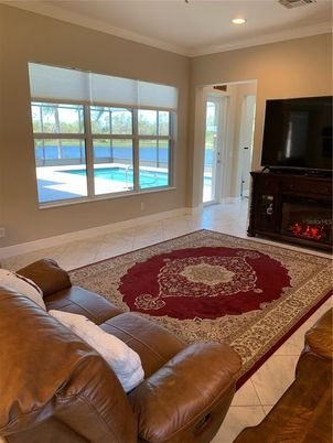Fireplace, Interior, Living room, Marble, Recessed Lighting, Water