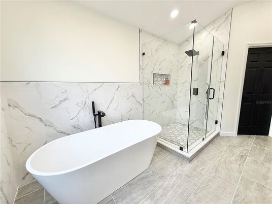 Bathroom, Free Standing Baths, Glass Shower, Interior, Marble Walls, Recessed Lighting