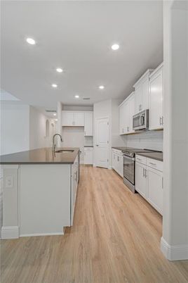 Interior, Kitchen, Recessed Lighting, Stainless Steel Appliances, Wood Texture Flooring