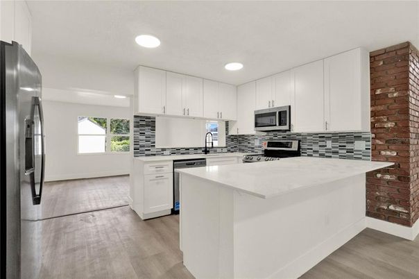 Interior, Kitchen, Recessed Lighting, Stainless Steel Appliances, Wood Texture Flooring