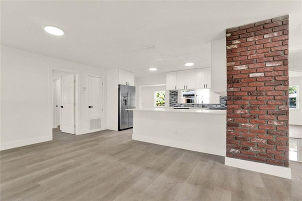 Interior, Kitchen, Recessed Lighting, Stainless Steel Appliances, Stone Walls, Wood Texture Flooring