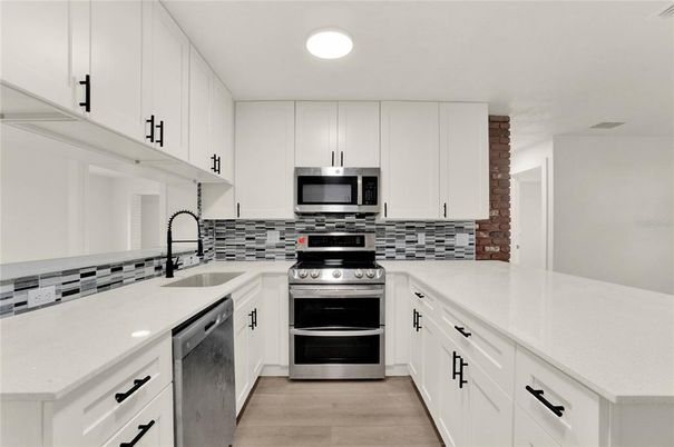 Interior, Kitchen, Recessed Lighting, Stainless Steel Appliances, Wood Texture Flooring