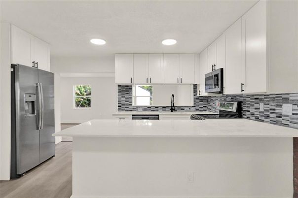 Interior, Kitchen, Recessed Lighting, Stainless Steel Appliances, Wood Texture Flooring