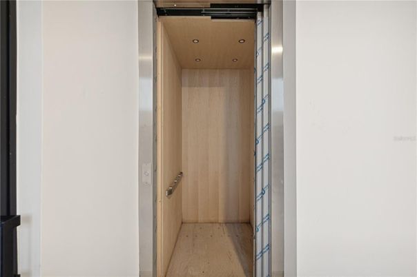 Elevator, Interior, Recessed Lighting, Wooden Ceilings, Wood Texture Flooring, Wooden Walls