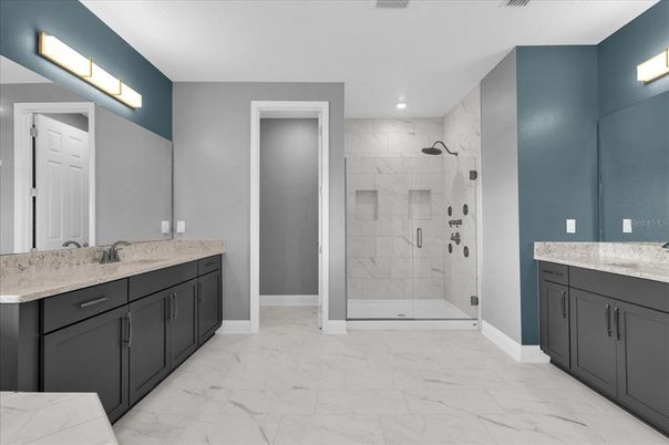 Bathroom, Dual Sink Vanities, Glass Shower, Interior, Marble, Marble Walls, Recessed Lighting