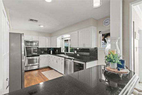 Interior, Kitchen, Recessed Lighting, Stainless Steel Appliances, Wood Texture Flooring