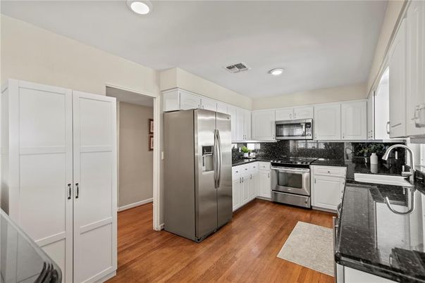 Interior, Kitchen, Recessed Lighting, Stainless Steel Appliances, Wood Texture Flooring