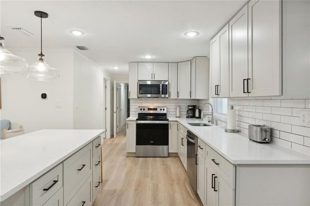 Interior, Kitchen, Pendant Lights, Recessed Lighting, Stainless Steel Appliances, Wood Texture Flooring