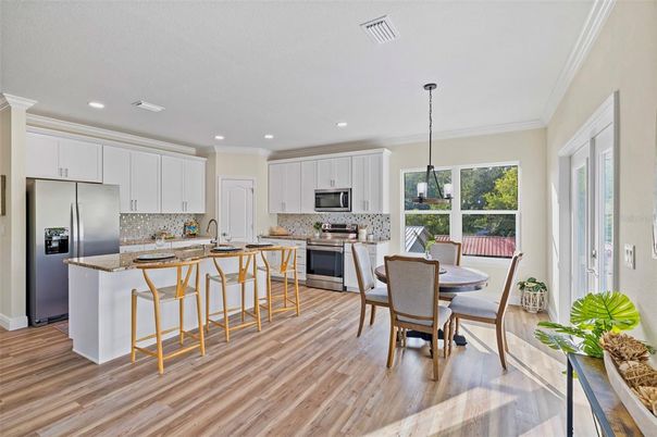 Dining room, Interior, Kitchen, Pendant Lights, Recessed Lighting, Stainless Steel Appliances, Wood Texture Flooring