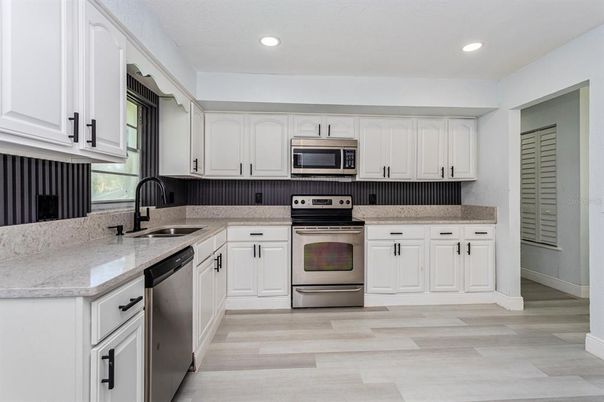 Interior, Kitchen, Recessed Lighting, Stainless Steel Appliances, Wood Texture Flooring