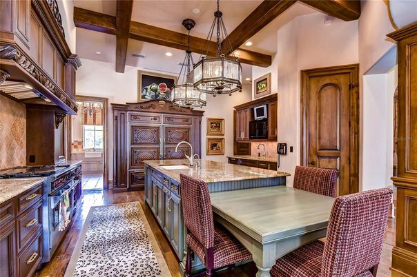 Chandelier, Dining room, Interior, Kitchen, Pendant Lights, Recessed Lighting, Stainless Steel Appliances, Wooden Beams, Wood Texture Flooring