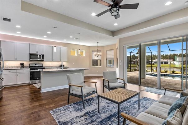 Chandelier, Interior, Kitchen, Living room, Pendant Lights, Recessed Lighting, Stainless Steel Appliances, Wood Texture Flooring