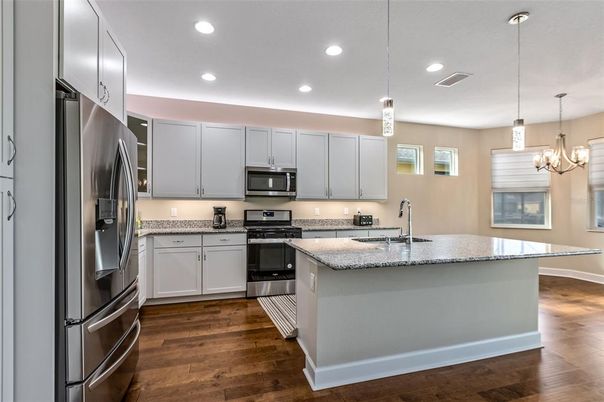 Chandelier, Interior, Kitchen, Pendant Lights, Recessed Lighting, Stainless Steel Appliances, Wood Texture Flooring