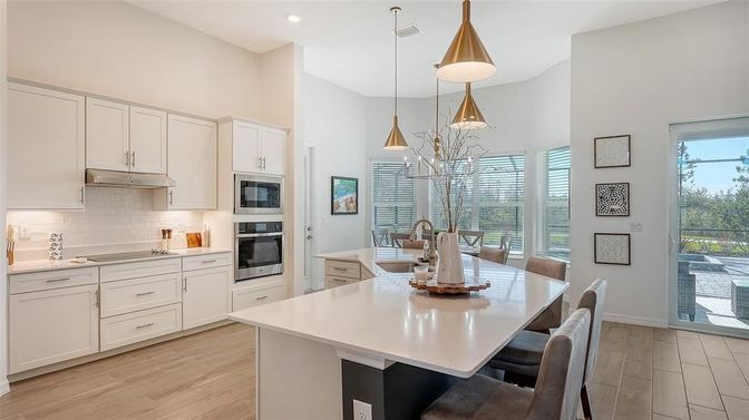 Dining room, Interior, Kitchen, Pendant Lights, Recessed Lighting, Stainless Steel Appliances, Wood Texture Flooring