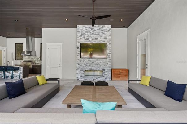 Fireplace, Interior, Kitchen, Living room, Recessed Lighting, Stainless Steel Appliances, Stone Walls