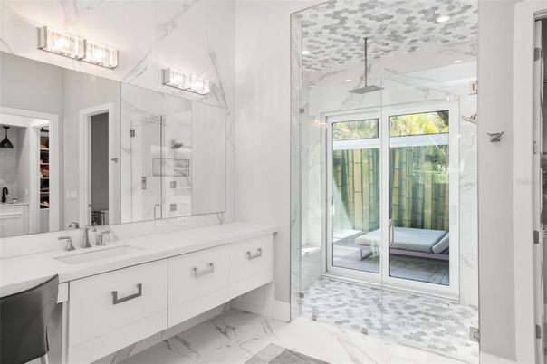 Bathroom, Dual Sink Vanities, Glass Shower, Interior, Marble, Marble Walls, Recessed Lighting