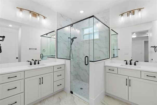 Bathroom, Dual Sink Vanities, Glass Shower, Interior, Marble, Marble Walls, Recessed Lighting